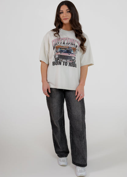 Woman wearing a graphic t-shirt and jeans on a white background
