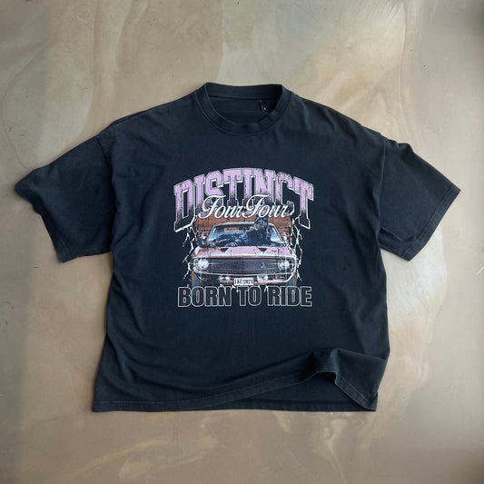 Vintage Black t-shirt with graphic design on a concrete surface