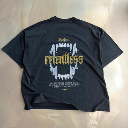 Vintage Black t-shirt with graphic design and text on a concrete background